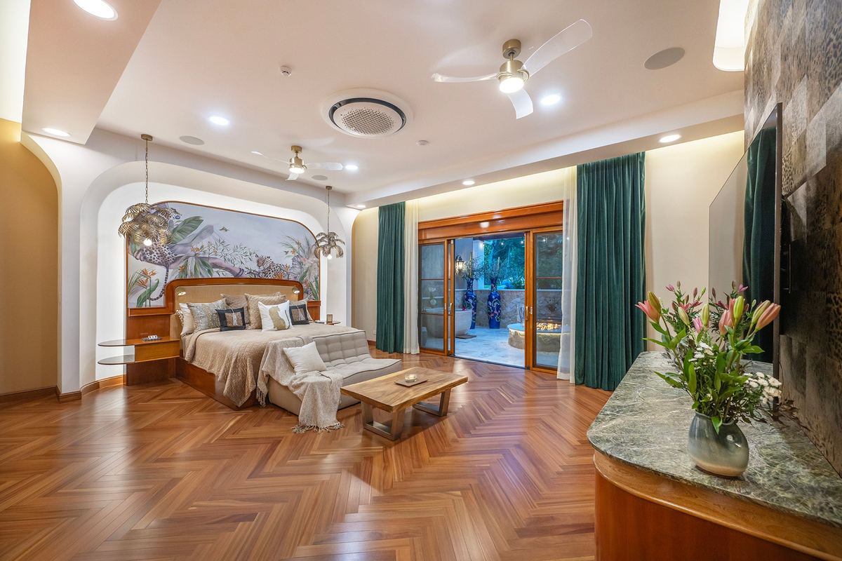 A primary suite opening onto its garden patio